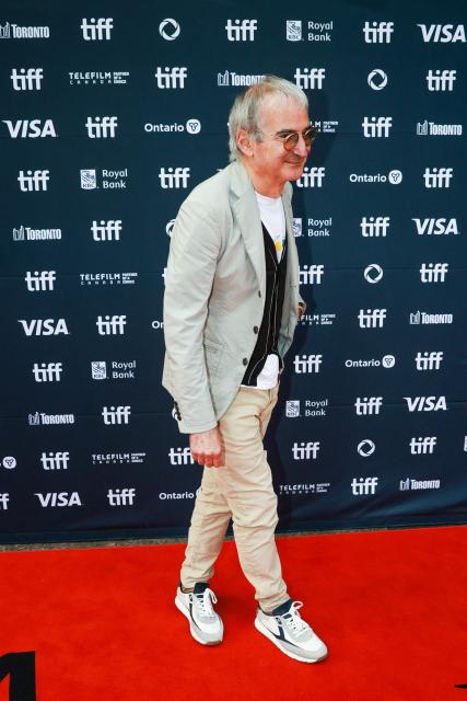 French filmmaker Olivier Assayas attends the premiere of "The Wizard of the Kremlin" at Princess of Wales Theatre, during the Toronto International Film Festival (TIFF) in Toronto, Ontario, on September 10, 2025. (Photo by Cole BURSTON / AFP)