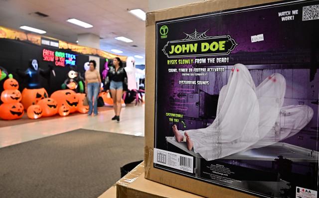 People browse through a selection of Halloween products for sale in West Covina, California, on September 10, 2025. Inflation in the US cooled off at the wholesale level in August but economists continue to caution that prices in core producer goods are significantly rising as the US economy shows warning signs on jobs and inflation. (Photo by Frederic J. BROWN / AFP)