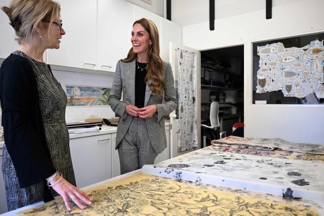 Britain's Catherine, Princess of Wales looks at designs during a visit to Marina Mill in Cuxton, south east England on September 11, 2025. Marina Mill was established in 1967, and is based in an old Victorian mill on the banks of the River Medway, where a small team produces fabrics using the traditional silk-screen method. (Photo by Chris J Ratcliffe / POOL / AFP)