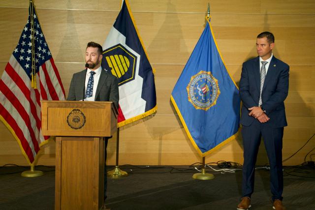 FBI Special Agent in Charge Robert Bohls (L) speaks as Commissioner of the Utah Department of Public Safety Beau Mason (R) looks on during a news conference at Utah Valley University in Orem, Utah, on September 11, 2025. The gunman who shot dead US right-wing youth leader Charlie Kirk in a targeted killing remained at large Thursday but authorities said they have video images of the suspect and have recovered a "high-powered" rifle. Kirk, a 31-year-old superstar on the Republican right who was credited with helping Donald Trump return to the presidency last year, was shot while addressing a large crowd at Utah Valley University on Wednesday. (Photo by Bastien INZAURRALDE / AFP)
