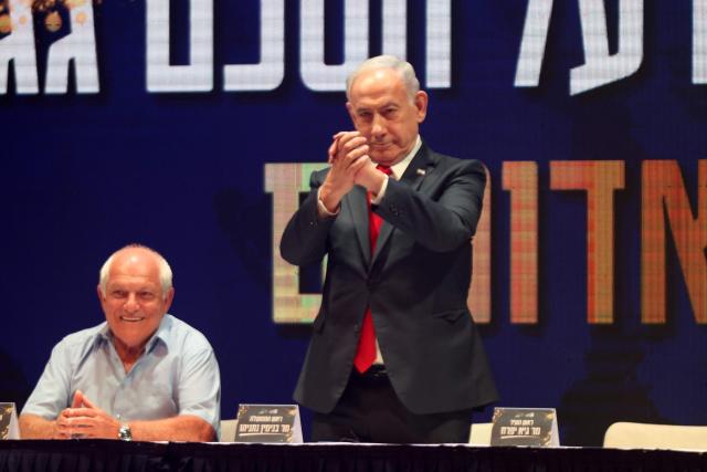 Israeli Prime Minister Benjamin Netanyahu attends a signing ceremony for a framework agreement, aiming to speed up development in the Israeli settlement of Maale Adumim, in the occupied-West Bank settlement on September 11, 2025. In August 2025, Israel approved a major settlement project in an area of the occupied West Bank that the international community has warned threatens the viability of a future Palestinian state.  The plans include the building of around 3,400 homes on the ultra-sensitive tract of land, which lies between Jerusalem and the Israeli settlement of Maale Adumim. (Photo by Menahem KAHANA / AFP)