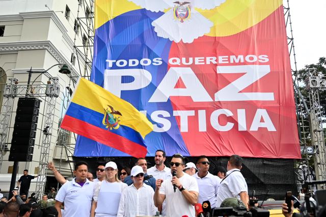 Ecuador's President Daniel Noboa (C) speaks after participating in a march for peace and justice in Guayaquil, Ecuador, on September 11, 2025. (Photo by MARCOS PIN / AFP)