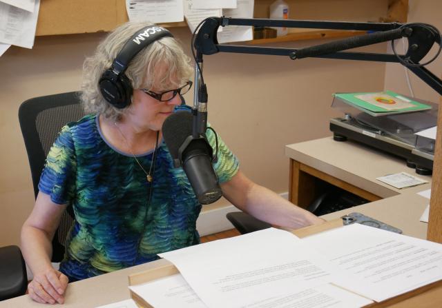 Volunteer Bonnie Ralston hosts a show in the Allegheny Mountain Radio studio, in Monterey, Virginia, on September 2, 2025. Allegheny Mountain Radio is one of the many stations across the United States imperiled by President Donald Trump's funding cuts. At Trump's request, Republicans in Congress voted to cut federal money for the Corporation for Public Broadcasting, the key funding source for National Public Radio (NPR) and the Public Broadcasting Service (PBS), both of which conservatives have long accused of liberal bias. (Photo by Pierre HARDY / AFP)