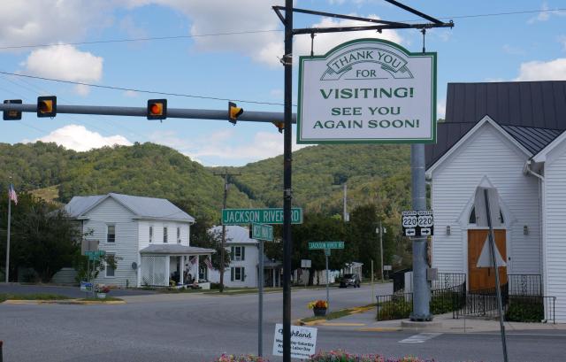 A sign on the main street of Monterey, Virginia, thanks visitors, on September 2, 2025. Allegheny Mountain Radio is one of the many stations across the United States imperiled by President Donald Trump's funding cuts. At Trump's request, Republicans in Congress voted to cut federal money for the Corporation for Public Broadcasting, the key funding source for National Public Radio (NPR) and the Public Broadcasting Service (PBS), both of which conservatives have long accused of liberal bias. (Photo by Pierre HARDY / AFP)