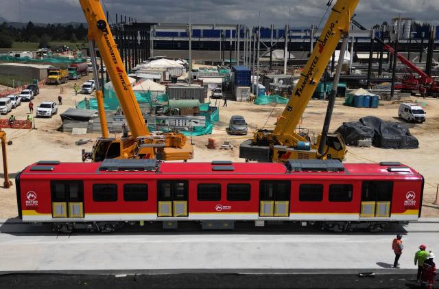 Aerial view showing a carriage from the first shipment of carriages for the Bogota metro during its presentation to the media in Bogota on September 11, 2025. (Photo by Raul ARBOLEDA / AFP)