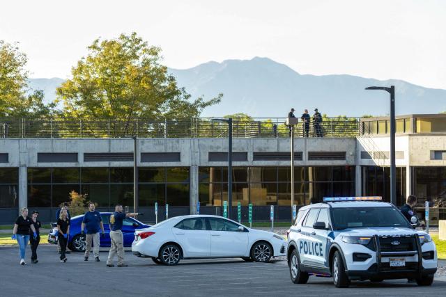 Agents with FBI forensic team investigate the scene where youth activist and influencer Charlie Kirk was shot during a public event at Utah Valley University in Orem, Utah, on September 11, 2025. The gunman who shot dead US right-wing youth leader Charlie Kirk in a targeted killing remained at large Thursday but authorities said they have video images of the suspect and have recovered a "high-powered" rifle. Kirk, a 31-year-old superstar on the Republican right who was credited with helping Donald Trump return to the presidency last year, was shot while addressing a large crowd at Utah Valley University on Wednesday. (Photo by Melissa MAJCHRZAK / AFP)