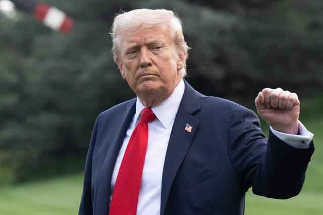US President Donald Trump walks to board Marine One as he departs from the South Lawn of the White House in Washington, DC, on September 11, 2025. Trump is going to New York to attend a Yankees baseball game. (Photo by SAUL LOEB / AFP)