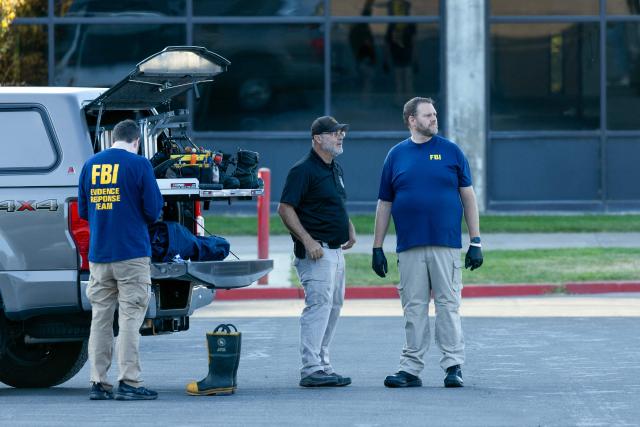 Agents with FBI forensic team prepare to investigate the scene where youth activist and influencer Charlie Kirk was shot during a public event at Utah Valley University in Orem, Utah, on September 11, 2025. The gunman who shot dead US right-wing youth leader Charlie Kirk in a targeted killing remained at large Thursday but authorities said they have video images of the suspect and have recovered a "high-powered" rifle. Kirk, a 31-year-old superstar on the Republican right who was credited with helping Donald Trump return to the presidency last year, was shot while addressing a large crowd at Utah Valley University on Wednesday. (Photo by Melissa MAJCHRZAK / AFP)