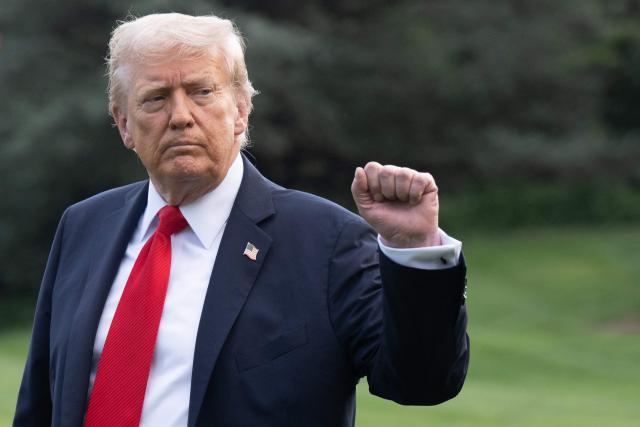 US President Donald Trump walks to board Marine One as he departs from the South Lawn of the White House in Washington, DC, on September 11, 2025. Trump is going to New York to attend a Yankees baseball game. (Photo by SAUL LOEB / AFP)