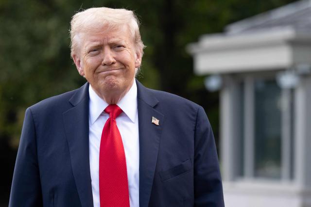 US President Donald Trump walks to speak to the press before boarding Marine One prior to departing from the South Lawn of the White House in Washington, DC, on September 11, 2025. Trump is going to New York to attend a Yankees baseball game. (Photo by SAUL LOEB / AFP)