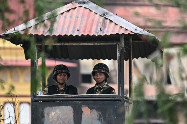Army personnel keep watch outside the President House during a curfew imposed to restore law and order in Kathmandu on September 12, 2025. The army has imposed a curfew in the Himalayan nation of 30 million people, with soldiers patrolling the largely quiet streets after the worst violence in two decades. (Photo by Pedro Pardo / AFP)