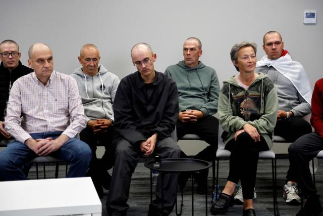 Belsat journalist Iryna Slaunikava (front row R), cameraman Pavel Padabed (back row 2ndL), trade union leader Aliaksandr Yarashuk (back row, 2ndL), politician Dzmitry Kuchuk (front row L), and others look on during a press conference with exiled Belarusian opposition leader Tikhanovskaya and other freed political prisoners in Vilnius on September 12, 2025, a day after Belarus freed 52 political prisoners in a release mediated by the United States. Among those released are an EU staff member, journalists, and dissidents. Many were detained during a brutal crackdown and later prosecuted on what rights groups denounced as politically motivated charges. (Photo by Petras Malukas / AFP)