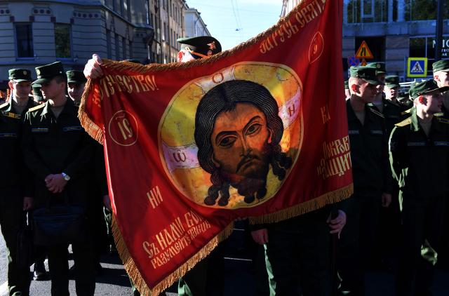 Military cadets participate in a religious procession marking the 301st anniversary of the transfer of the relics of St. Alexander Nevsky, who is considered to be a heavenly protector of Saint Petersburg, in central Saint Petersburg on September 12, 2025. (Photo by Olga MALTSEVA / AFP)
