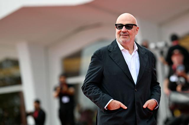 Italian director Gianfranco Rosi attends the red carpet for the movie "Sotto le Nuvole" (Below the Clouds) presented in competition at the 82nd International Venice Film Festival, at Venice Lido on August 30, 2025. (Photo by Tiziana FABI / AFP)