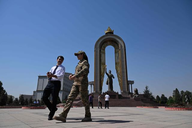 Pedestrians walk past the Monument of Ismoil Somoni on the Ozodi square in Dushanbe, Tajikistan's capital on September 12, 2025. (Photo by PRAKASH MATHEMA / AFP)