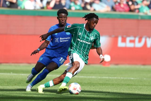 Bayer Leverkusen's French defender #16 Axel Tape (L) and Bremen's Belgian midfielder #07 Samuel Mbangula vie for the ball during the German first division Bundesliga football match between Werder Bremen and Bayer Leverkusen in Bremen on August 30, 2025. (Photo by Ibrahim OT / AFP) / DFL REGULATIONS PROHIBIT ANY USE OF PHOTOGRAPHS AS IMAGE SEQUENCES AND/OR QUASI-VIDEO