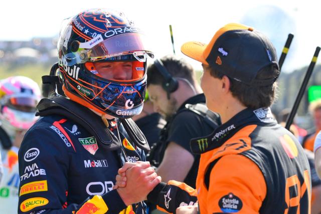 McLaren's Australian driver Oscar Piastri (R) is congratulated by Red Bull Racing's Dutch driver Max Verstappen after winning the pole position during the qualifying session of the Formula One Dutch Grand Prix at The Circuit Zandvoort, western Netherlands, on August 30, 2025. (Photo by JOHN THYS / AFP)