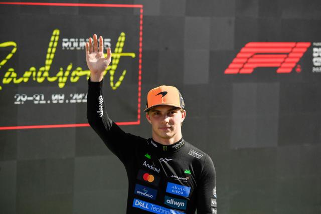 McLaren's Australian driver Oscar Piastri greets the crowd after winning the pole position during the qualifying session of the Formula One Dutch Grand Prix at The Circuit Zandvoort, western Netherlands, on August 30, 2025. (Photo by JOHN THYS / AFP)