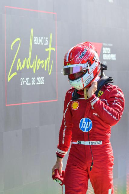 Six-placed Ferrari's Monegasque driver Charles Leclerc looks down after the qualifying session of the Formula One Dutch Grand Prix at The Circuit Zandvoort, western Netherlands, on August 30, 2025. (Photo by JOHN THYS / AFP)