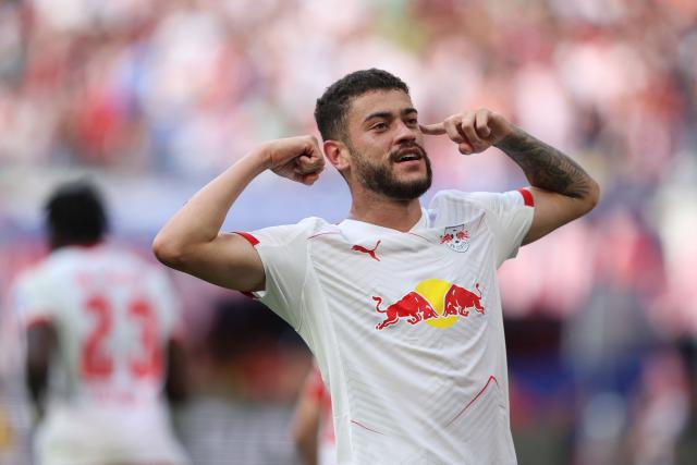 Leipzig's Brazilian forward #40 Romulo Cardoso celebrates scoring the 2-0 goal during the German first division Bundesliga football match between RB Leipzig and 1. FC Heidenheim 1846 in Leipzig on August 30, 2025. (Photo by Ronny HARTMANN / AFP) / DFL REGULATIONS PROHIBIT ANY USE OF PHOTOGRAPHS AS IMAGE SEQUENCES AND/OR QUASI-VIDEO