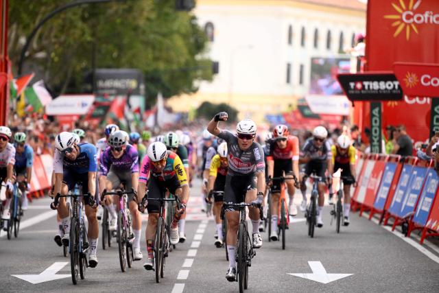 Team Alpecin's Belgian rider Jasper Philipsen (C) celebrates crossing first the finish line during the 8th stage of the Vuelta a Espana, a 158 km race between Monzon Templario and Zaragoza, on August 30, 2025. (Photo by Josep LAGO / AFP)