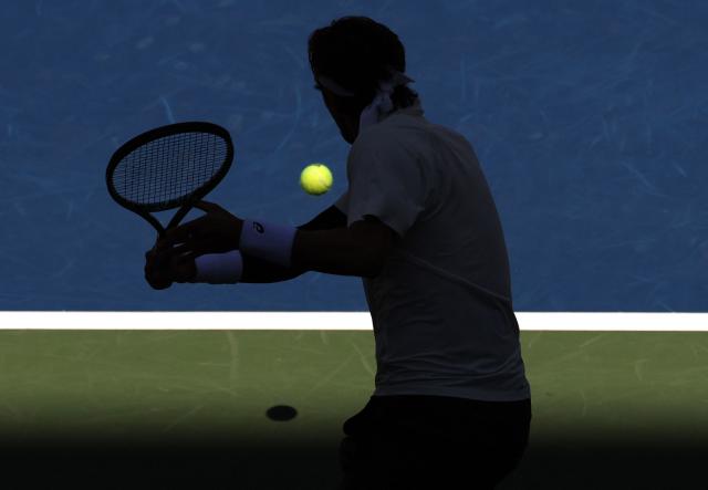 Italy's Lorenzo Musetti plays a shot to Italy’s Flavio Cobolli during their men's singles third round match on day seven of the US Open tennis tournament at the USTA Billie Jean King National Tennis Center in New York City, on August 30, 2025. (Photo by TIMOTHY A. CLARY / AFP)