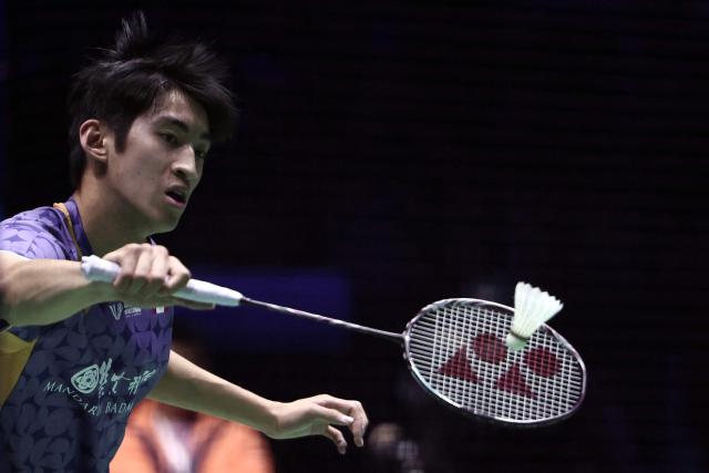 Canada's Victor Lai hits a return to China's Shi Yu Qi during their men's semi-final match at the Badminton BWF World Championships at the Adidas Arena in Paris, on August 30, 2025. (Photo by Thibaud MORITZ / AFP)