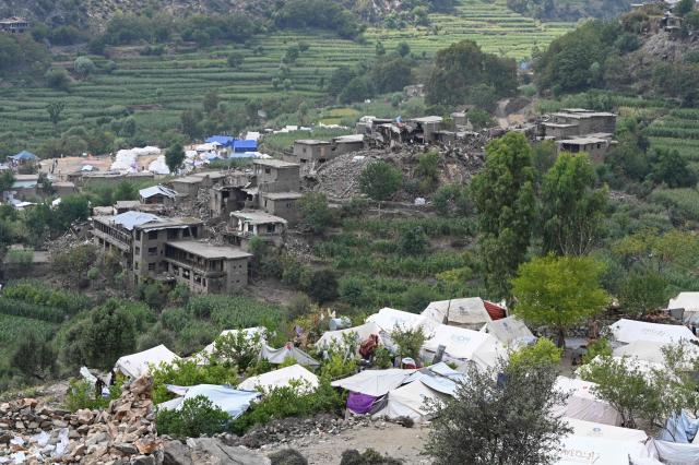 A general view shows makeshift tents at a relief camp set up in the aftermath of an earthquake at Mazar Dara village in Nurgal district, Kunar province on September 14, 2025. Afghanistan's deputy prime minister visited the country's east on September 12, becoming the first member of the Taliban government to do so nearly two weeks after a powerful earthquake killed more than 2,200 people. (Photo by Wakil KOHSAR / AFP)