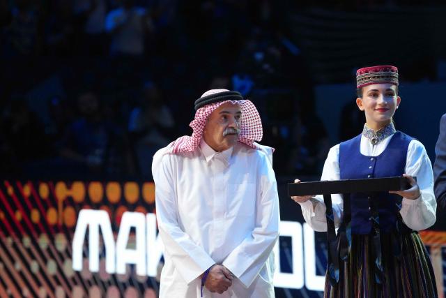 President of the International Basketball Federation (FIBA) Sheikh Saud Ali Al Thani (L) is pictured during the medal ceremony for the third place after the FIBA EuroBasket 2025 small final basketball match between Greece and Finland in Riga, Latvia, on September 14, 2025. (Photo by Gints Ivuskans / AFP)