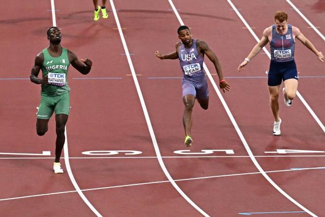 Nigeria's athlete Ezekiel Nathaniel, US' athlete Caleb Dean and Britain's athlete Alastair Chalmers compete in the men's 400m hurdles heats during the World Athletics Championships in Tokyo on September 15, 2025. (Photo by Jewel SAMAD / AFP)
