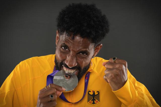 Silver medallist in the men's marathon Germany's Amanal Petros poses with his medal during a studio photo session on the sidelines of the World Athletics Championships in Tokyo on September 15, 2025. (Photo by Andrej ISAKOVIC / AFP)