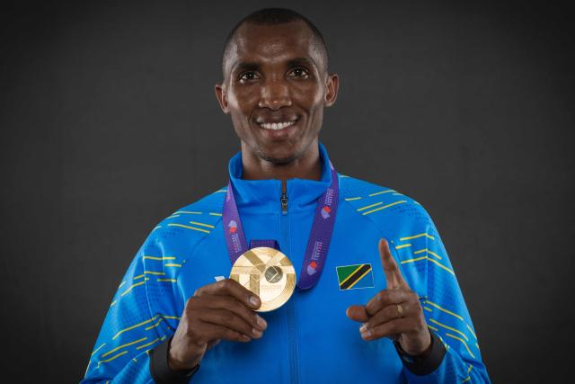 Gold medallist of the men's marathon Tanzania's Alphonce Felix Simbu poses with his medal for portraits during a studio photo session on the sidelines of the World Athletics Championships in Tokyo on September 15, 2025. (Photo by Andrej ISAKOVIC / AFP)