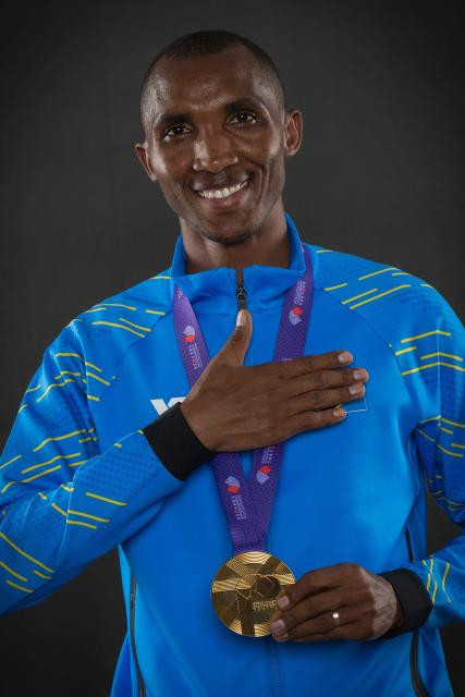 Gold medallist of the men's marathon Tanzania's Alphonce Felix Simbu poses with his medal for portraits during a studio photo session on the sidelines of the World Athletics Championships in Tokyo on September 15, 2025. (Photo by Andrej ISAKOVIC / AFP)