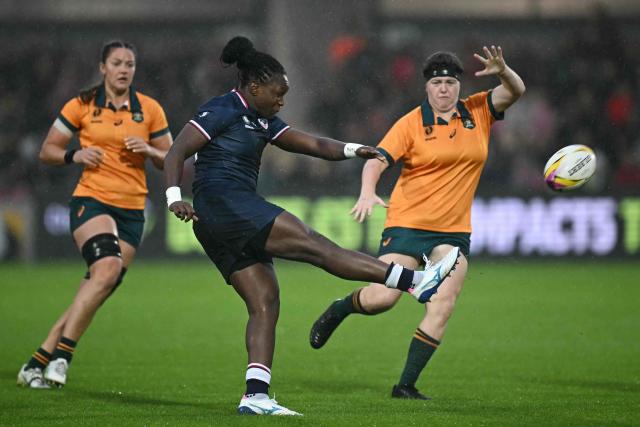 United States' wing Cheta Emba (C) kicks the ball during the Women’s Rugby World Cup pool A match between United States and Australia at York Community Stadium, York, northern England, on August 30, 2025. (Photo by Paul ELLIS / AFP)