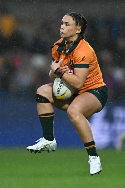 Australia's wing Desiree Miller catches the ball during the Women’s Rugby World Cup pool A match between United States and Australia at York Community Stadium, York, northern England, on August 30, 2025. (Photo by Paul ELLIS / AFP)