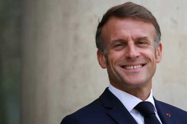 France's President Emmanuel Macron reacts as he waits for the arrival of European Council President Antonio Costa for a meeting at the presidential Elysee Palace, in Paris, on September 16, 2025. (Photo by Alain JOCARD / AFP)