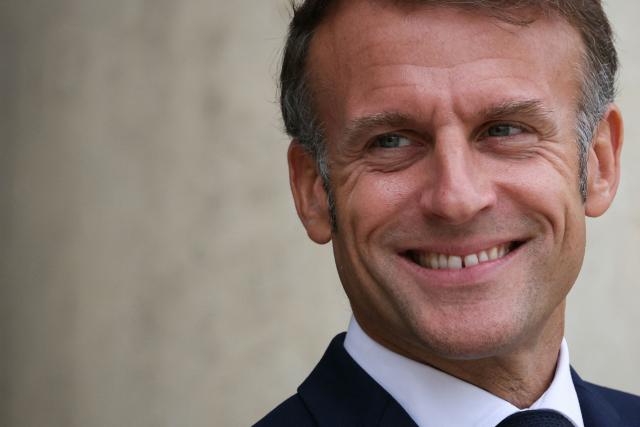 France's President Emmanuel Macron reacts as he waits for the arrival of European Council President Antonio Costa for a meeting at the presidential Elysee Palace, in Paris, on September 16, 2025. (Photo by Alain JOCARD / AFP)