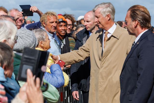 King Philippe - Filip of Belgium greets people at the promenade in front of the Kursaal Oostende Casino, part of a royal visit to the province of West Flanders, in Oostende, September 16, 2025. (Photo by KURT DESPLENTER / Belga / AFP) / Belgium OUT