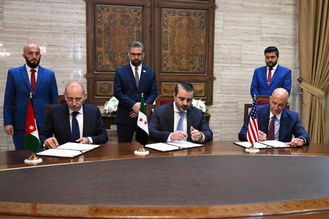 (From L) Jordan's Foreign Minister Ayman Safadi, Syrian Foreign Minister Asaad al-Shaibani and US special envoy for Syria Tom Barrack sign an agreement ahead of a press conference in Damascus on September 16, 2025. Shaibani announced on September 16 a plan backed by Jordan and the United States to restore calm to Druze-majority Sweida province, which witnessed deadly violence in July. (Photo by LOUAI BESHARA / AFP)