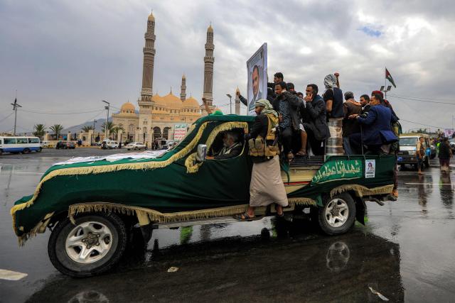 Vehicles carry caskets during a funeral for Huthi military media members who were killed the previous week in an Israeli airstrike, outide the Saleh Grand Mosque in the Huthi-held capital Sanaa on September 16, 2025. The Huthi rebels' caretaker prime minister had vowed on September 12 to keep fighting Israel despite recent strikes near the rebel-held capital Sanaa that killed his predecessor and nearly half of his cabinet. (Photo by Mohammed HUWAIS / AFP)