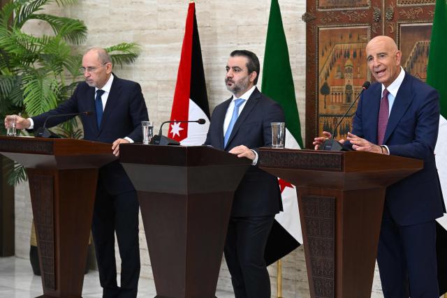 (From L) Jordan's Foreign Minister Ayman Safadi, Syrian Foreign Minister Asaad al-Shaibani and US special envoy for Syria Tom Barrack attend a press conference after the signing of an agreement in Damascus on September 16, 2025. Shaibani announced on September 16 a plan backed by Jordan and the United States to restore calm to Druze-majority Sweida province, which witnessed deadly violence in July. (Photo by LOUAI BESHARA / AFP)
