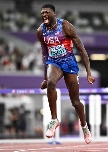 US' athlete Cordell Tinch celebrates after winning the men's 110m hurdles final during the World Athletics Championships in Tokyo on September 16, 2025. (Photo by Jewel SAMAD / AFP)