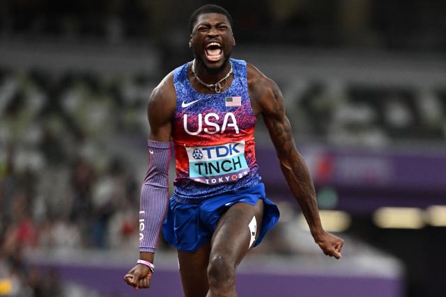 TOPSHOT - US' athlete Cordell Tinch celebrates after winning the men's 110m hurdles final during the World Athletics Championships in Tokyo on September 16, 2025. (Photo by Jewel SAMAD / AFP)