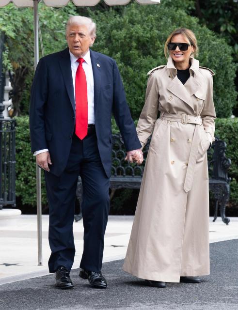 US President Donald Trump and First Lady Melania Trump walk to Marine One prior to departing from the South Lawn of the White House in Washington, DC, September 16, 2025, as they travel to the UK. Trump is heading to the UK for a State Visit. (Photo by SAUL LOEB / AFP)