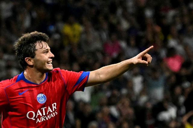 Paris Saint-Germain's Portuguese midfielder #87 Joao Neves celebrates scoring his team's sixth goal and his third goal during the French L1 football match between Toulouse FC and Paris Saint-Germain at The TFC Stadium in Toulouse, southwestern France on August 30, 2025. (Photo by Lionel BONAVENTURE / AFP)