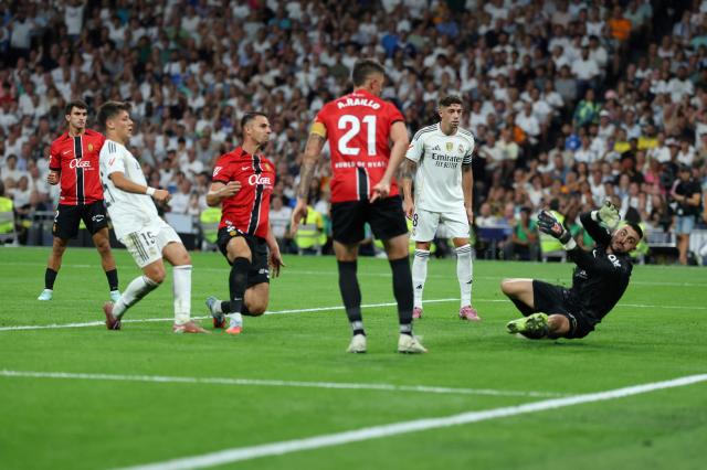 Real Madrid's Turkish midfielder #15 Arda Guler scores a goal that was later annulled during the Spanish league football match between Real Madrid CF and Real RCD Mallorca at the Santiago Bernabeu stadium in Madrid on August 30, 2025. (Photo by Thomas COEX / AFP)