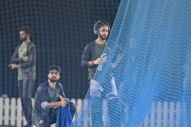 Pakistan's captain Salman Agha (R) and teammate Abrar Ahmed (L) attend a practice session at the International Cricket Council (ICC) Academy in Dubai on September 16, 2025, ahead of their Asia Cup 2025 Twenty20 international cricket match against the UAE. (Photo by Sajjad HUSSAIN / AFP)