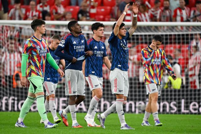 Arsenal players acknowledge supporters at the end of the UEFA Champions League first round day 1 football match between Athletic Club Bilbao and Arsenal at the San Mames stadium in Bilbao on September 16, 2025. Arsenal won 0-2. (Photo by ANDER GILLENEA / AFP)