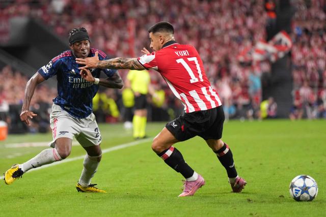 Arsenal's English forward #20 Noni Madueke (L) is challenged by Athletic Bilbao's Spanish defender #17 Yuri Berchiche during the UEFA Champions League first round day 1 football match between Athletic Club Bilbao and Arsenal at the San Mames stadium in Bilbao on September 16, 2025. (Photo by Cesar MANSO / AFP)