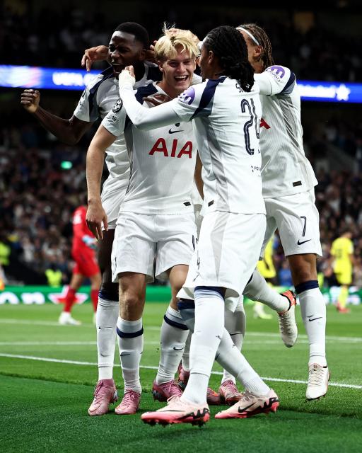 Tottenham Hotspur's Swedish midfielder #15 Lucas Bergvall (2L) celebrates the team's first goal during the UEFA Champions League football league stage match between Tottenham Hotspur and Villarreal at the Tottenham Hotspur Stadium in London, on September 16, 2025. (Photo by HENRY NICHOLLS / AFP)